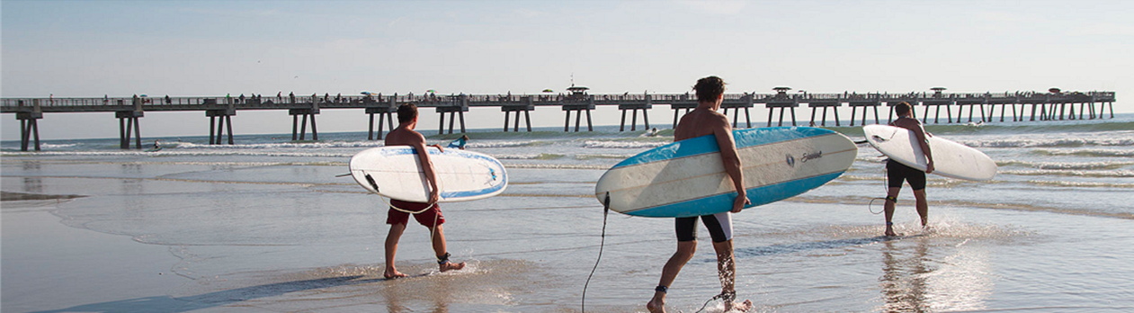 Photo of surfers on the beach in the Jacksonville, Florida area